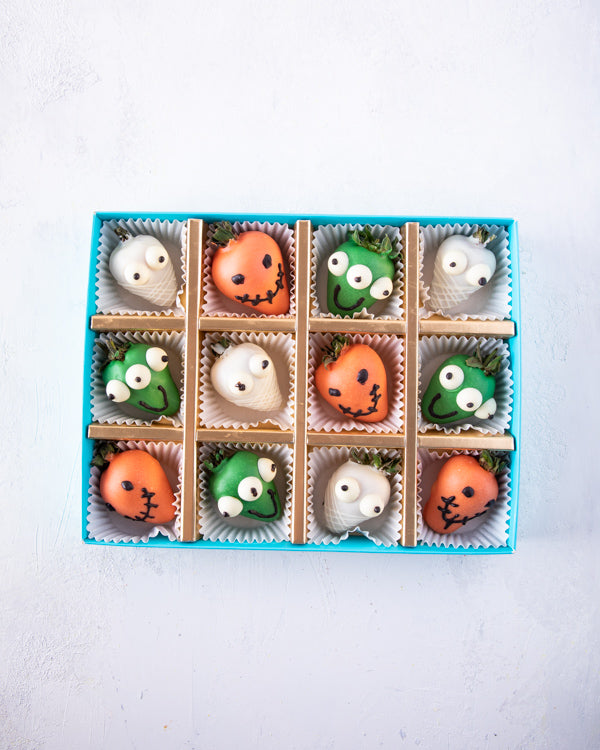 Spooktacular StrawberryChocolate & Confectionery12pcs dressed-up strawberries, dipped in colored chocolate and decorated with additional melted chocolate. Packed as shown in the picture Tray dimensions: length: 19cm wide: 24cm HANDLING AND STORAGE Keep aw