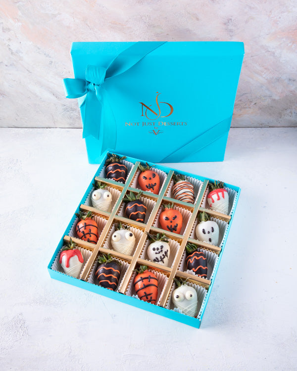 Spooky StrawberryChocolate & Confectionery16pcs dressed-up strawberries are dipped in colored chocolate and Dark chocolate. Hand designed, decorated with edible glitter Box dimensions: length: 24cm wide: 24cm HANDLING AND STORAGE Keep away from direct hea