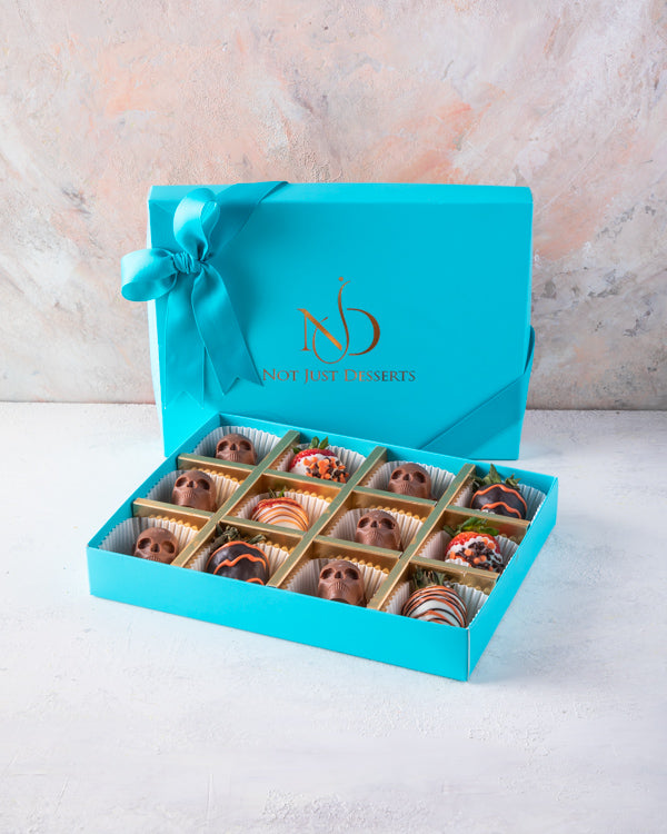 Spooktacular BoxChocolate & Confectionery6p pieces chocolate covered strawberries, 6 pieces pure Belgian chocolate skulls. Assorted Spooktacular box Box dimensions: length: 19cm wide: 24cm HANDLING AND STORAGE Keep away from direct heat and sunlight All o