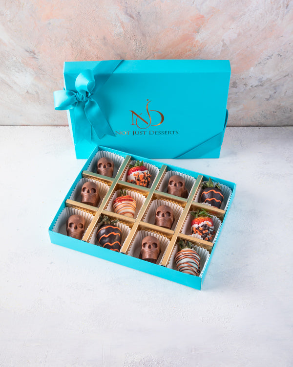 Spooktacular BoxChocolate & Confectionery6p pieces chocolate covered strawberries, 6 pieces pure Belgian chocolate skulls. Assorted Spooktacular box Box dimensions: length: 19cm wide: 24cm HANDLING AND STORAGE Keep away from direct heat and sunlight All o