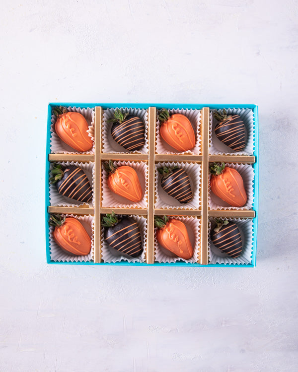 Halloween Special StrawberriesChocolate & Confectionery12pcs dressed-up strawberries, dipped in colored chocolate and Dark chocolate. and Decorated with additional melted chocolate. Packed as shown in the picture Tray dimensions: length: 19cm wide: 24cm H