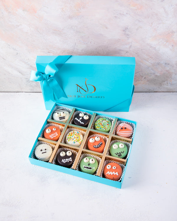 Spooky Yummy OreoSnacks12pcs Chocolate Oreo sandwiched in delicious milk and colorful chocolate. Each piece is hand designed in spooky combinations Packed as shown in the picture Box dimensions: length: 19cm wide: 24cm HANDLING AND STORAGE Keep away from