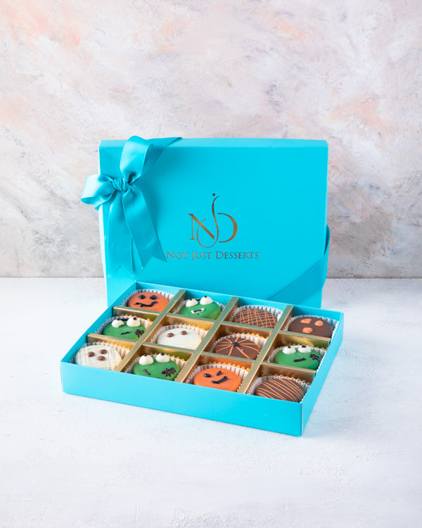 Trick or Treat Oreo BoxSnacks12pcs Chocolate Oreo sandwiched in delicious milk and colorful chocolate. Each piece is hand designed in spooky combinations Packed as shown in the picture Box dimensions: length: 19cm wide: 24cm HANDLING AND STORAGE Keep away