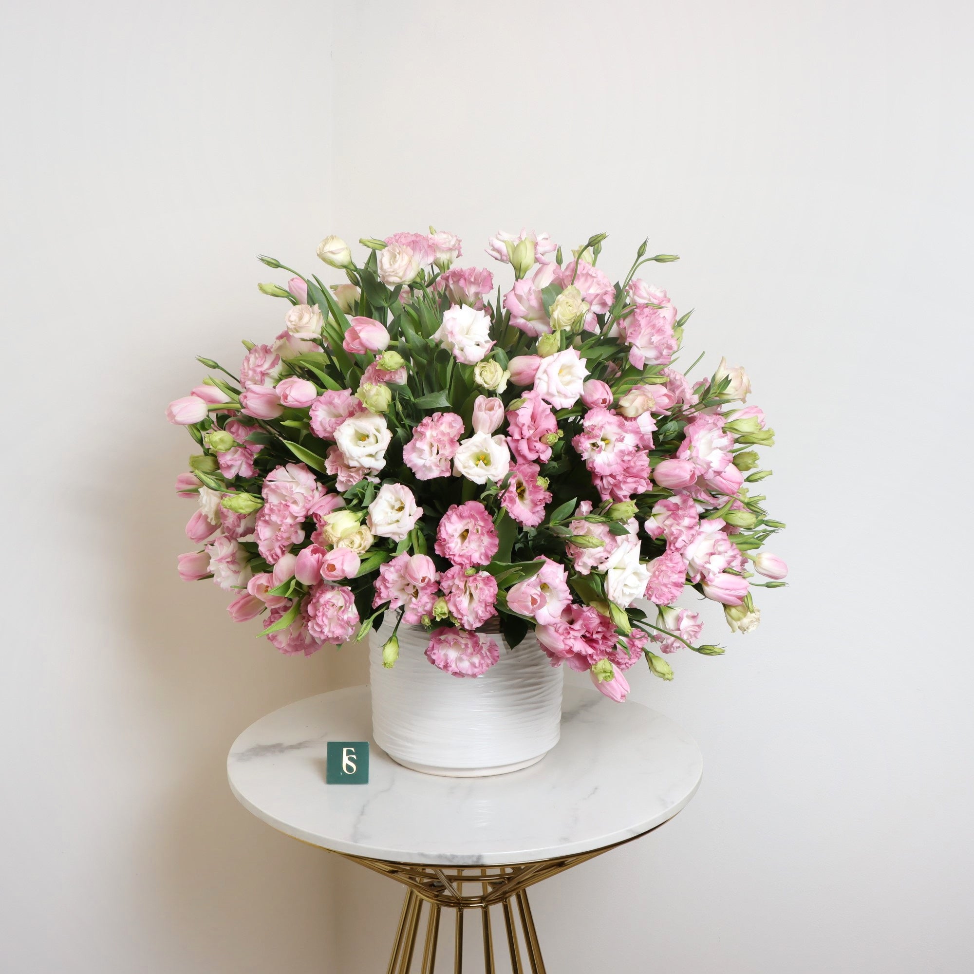 Lisianthus and Tulips EleganceSame-day delivery Treat yourself or a special someone to a stunning bouquet of beauty and love. Ready to impress and make your loved one smile, this romantic bouquet will fill the air with its natural fragrance. Make your gra
