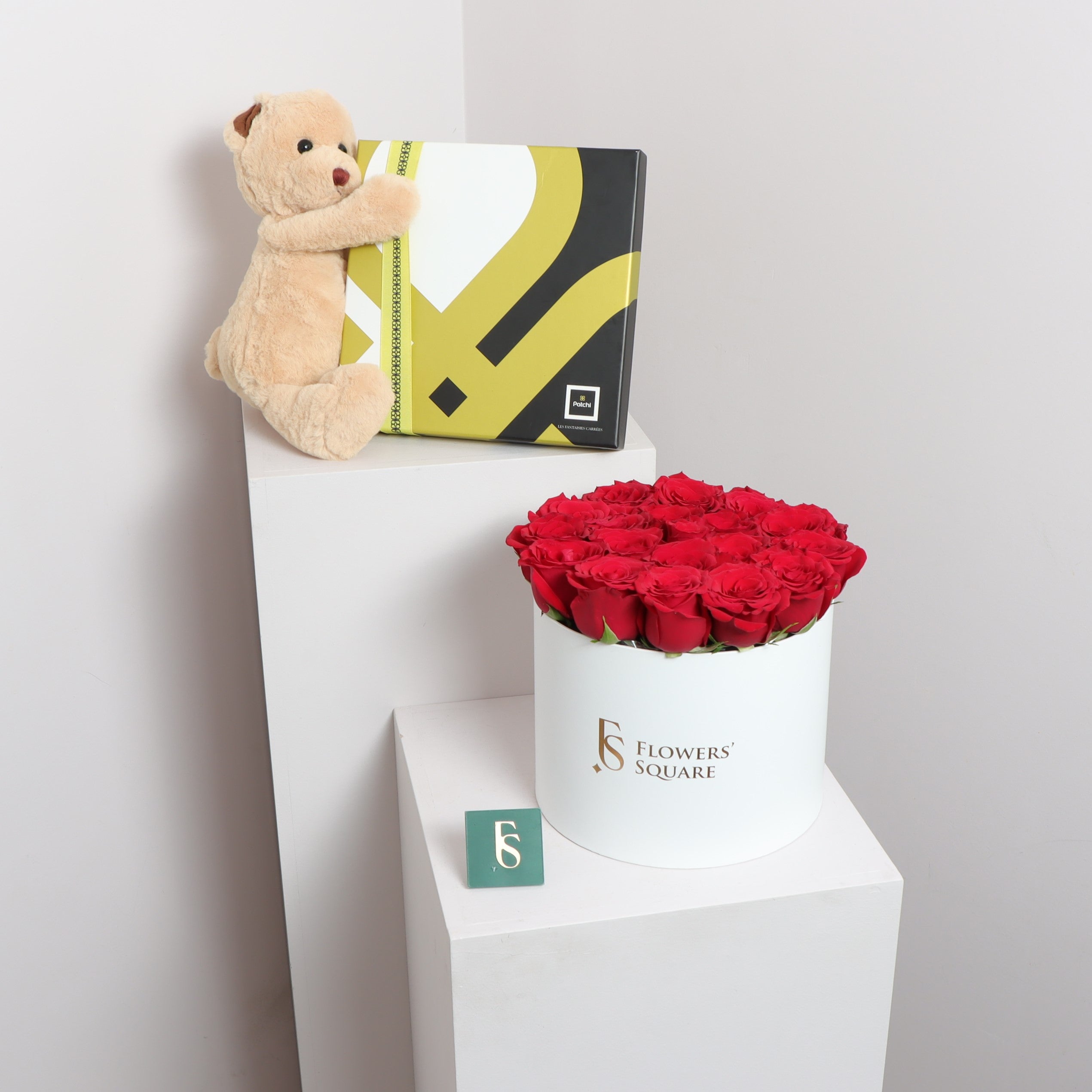 Patchi Teddy Flower BoxFlowersSame-day delivery This exquisite gift box features a charming teddy bear and a beautiful arrangement of flowers. With Patchi's delectable chocolates enclosed inside, this box is perfect for any occasion and is sure to bring d