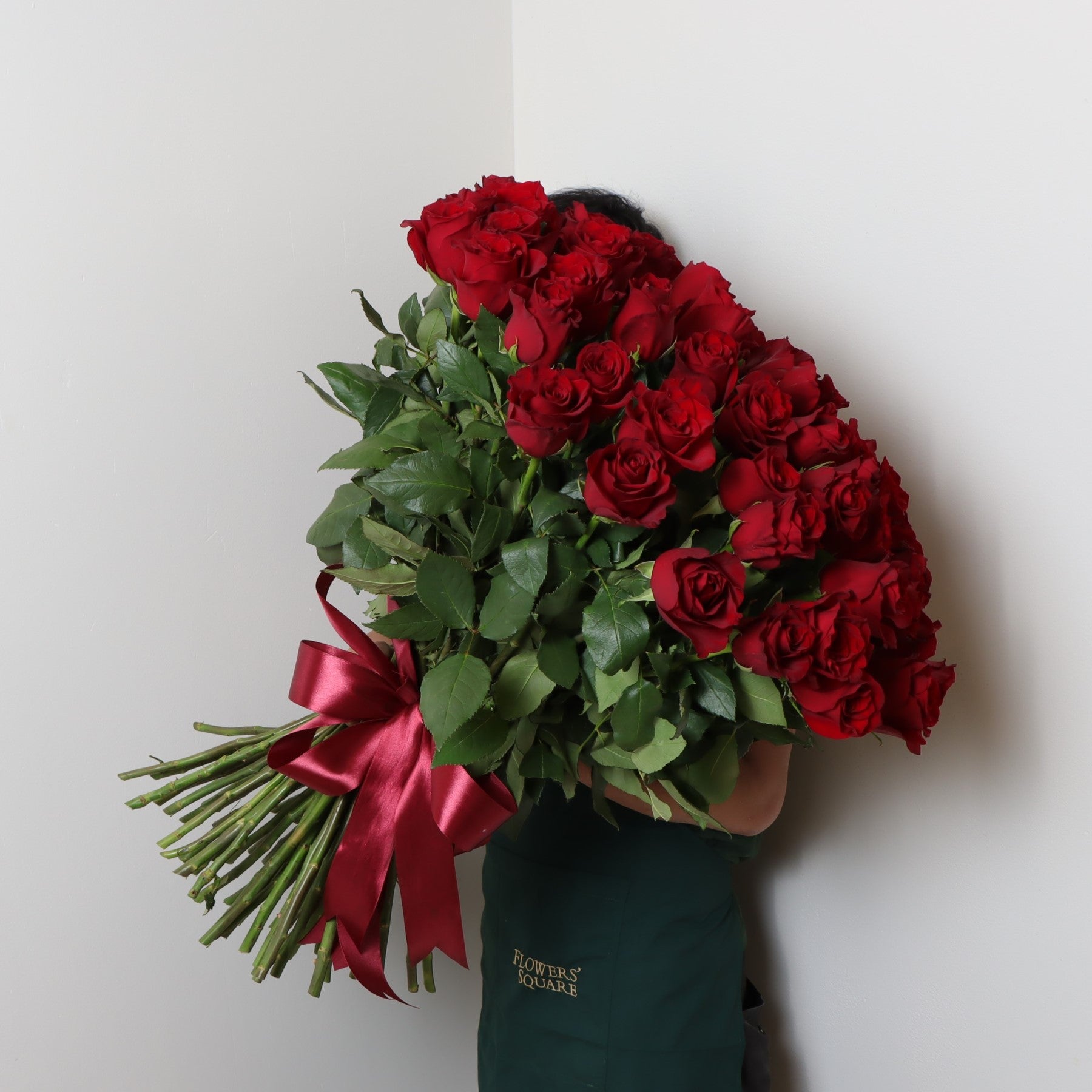 70 Red Premium Roses BouquetFlowersSame-day delivery This stunning bouquet features 70 premium red roses, carefully selected for their vibrant color and luxurious appearance. Perfect for any special occasion or romantic gesture, these roses are sure to ma