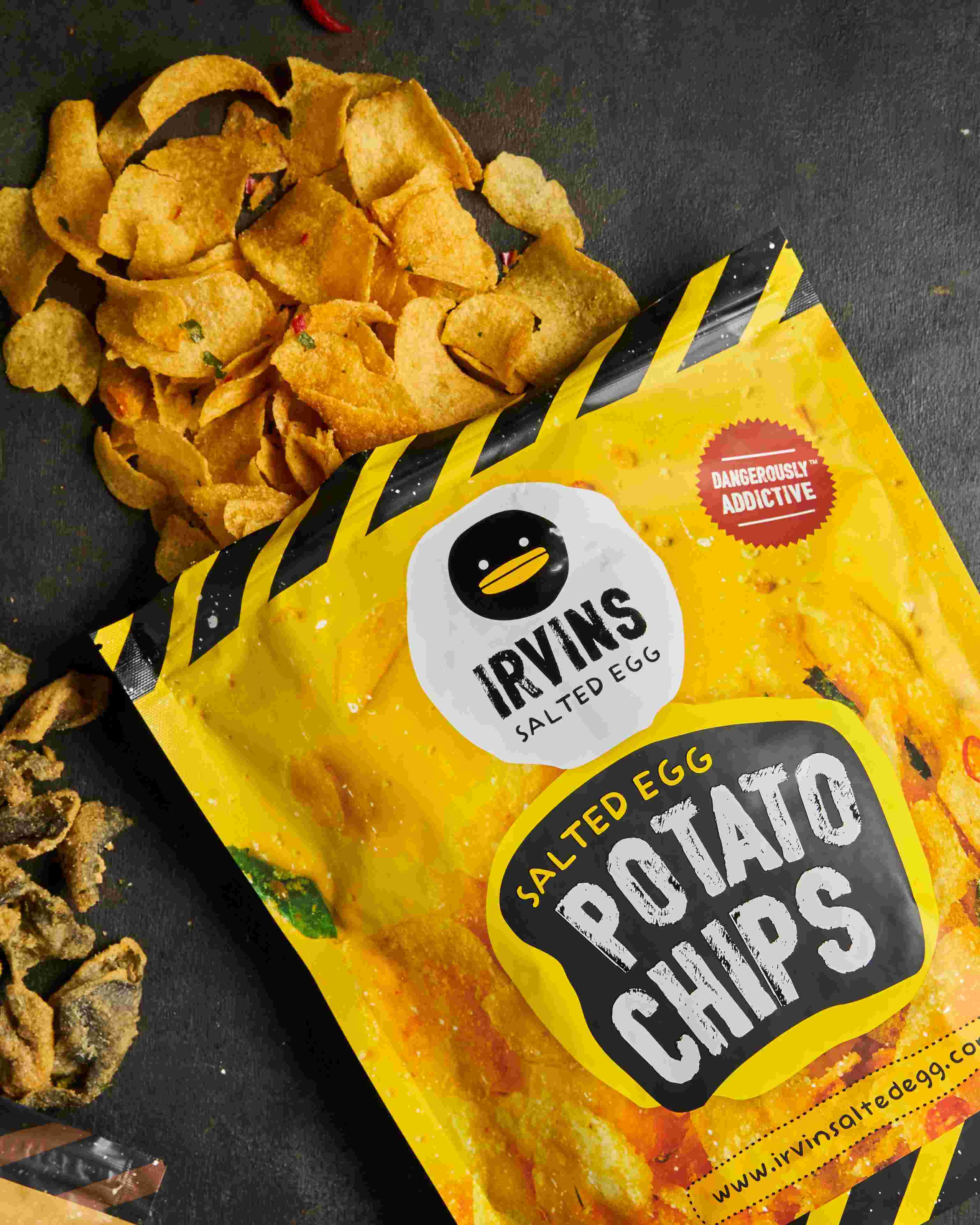 IRVINS Salted Egg Potato Chips (105 grams)SnacksIrvins Salted Egg Potato Chips Are Formulated by Our Expert Chefs in Singapore. Thinly Sliced Potatoes Are Fried to a Golden Crisp, Mixed With Real Salted Egg Yolk, Aromatic Curry Leaves, and Vibrant Red Chi