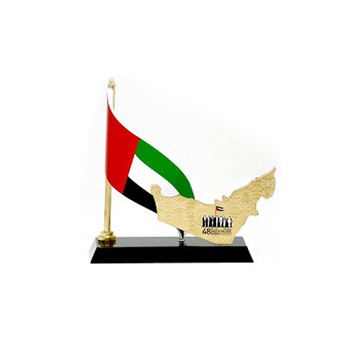 UAE map with gold metal plating and UAE flag and national day logo on front mounted on black base size: 20 cm total lengthLetstango PromoUAE map with gold metal plating and UAE flag and national day logo on front mounted on black base size: 20 cm total le