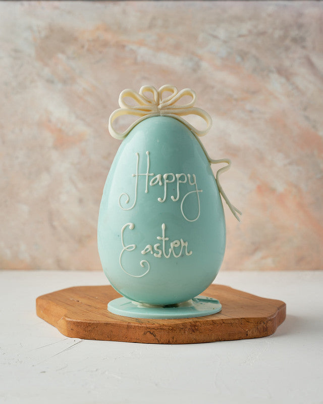 Egg with a BowChocolate & ConfectioneryYour Gift Contains: • Personalize Text up to 8 characters • Chocolate Egg: 500 grams approx. • Fillings: 50gms mini Pretzels, 100gms Mini Marshmallows, 50grams drageè • Size of egg: 14×14x 24cm • Box Size: 26x26x27cm