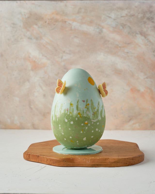 Hand Designed Easter EggChocolate & ConfectioneryYour Gift Contains: • 500 grams hand designed chocolate egg decorated with edible butterflies • Fillings: Pretzels, Marshmallows, Drageè, • Box Size: 13x13x26cm Handling and Storage • Keep away from direct