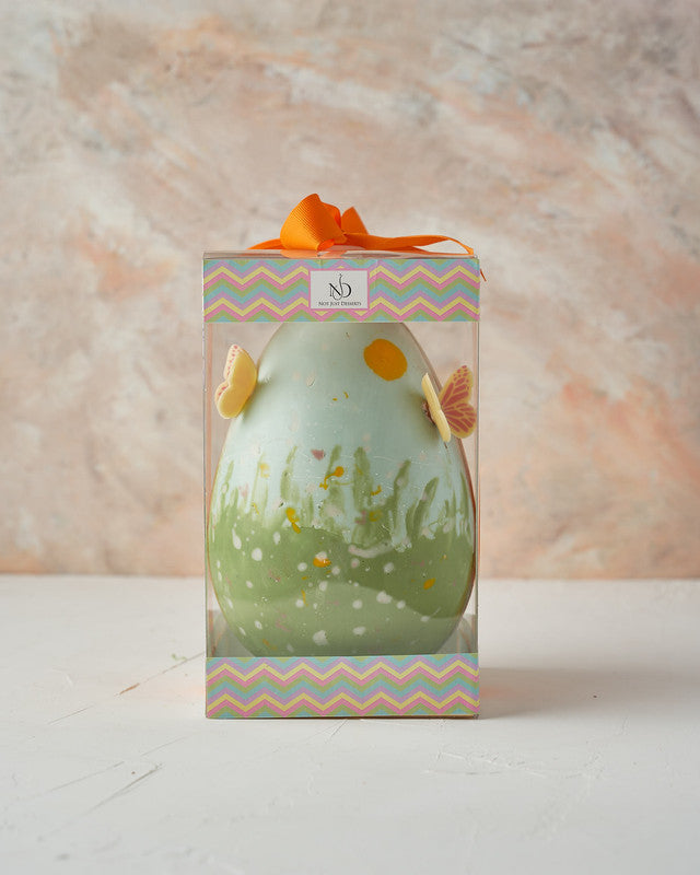 Hand Designed Easter EggChocolate & ConfectioneryYour Gift Contains: • 500 grams hand designed chocolate egg decorated with edible butterflies • Fillings: Pretzels, Marshmallows, Drageè, • Box Size: 13x13x26cm Handling and Storage • Keep away from direct