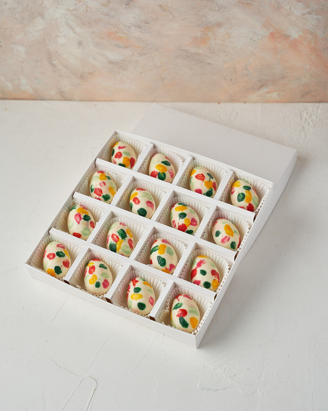 Colorful Easter EggsChocolate & ConfectioneryYour Gift Contains: • 16 colorful chocolate eggs • White chocolate eggs • Weight: approx. 360 grams • Box Size: 24x24x4cm Handling and Storage • Keep away from direct heat and sunlight • Best stored between 8-1