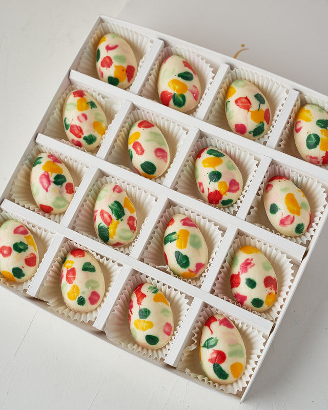 Colorful Easter EggsChocolate & ConfectioneryYour Gift Contains: • 16 colorful chocolate eggs • White chocolate eggs • Weight: approx. 360 grams • Box Size: 24x24x4cm Handling and Storage • Keep away from direct heat and sunlight • Best stored between 8-1