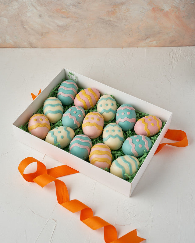 15 Easter eggs boxChocolate & ConfectioneryYour Gift Contains: • 15 assorted, hand designed chocolate Eggs • Weight: 1000 grams approx., Weight of each egg: 65 grams approx. • Box Size: 20.5x28.5x9.5xm Handling and Storage • Keep away from direct heat and
