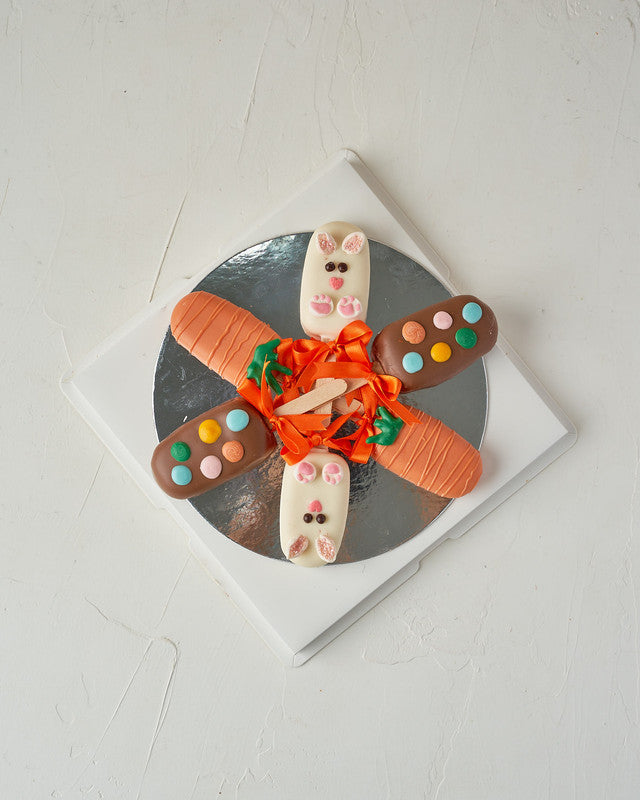 6 Easter Theme CakesiclesChocolate & ConfectioneryYour Gift Contains: • 3 Red Velvet and 3 Vanilla Cakesicles • Designed as carrots and bunny • Box Size: 23x23x14cm Handling and Storage • Keep away from direct heat and sunlight • Best stored between 8-15