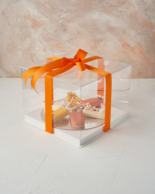 Easter Theme CakesiclesChocolate & ConfectioneryYour Gift Contains: • 3 Red Velvet and 3 Vanilla Cakesicles • Designed as carrots, bunny, unicorn, and chick • Box Size: 23x23x14cm Handling and Storage • Keep away from direct heat and sunlight • Best store