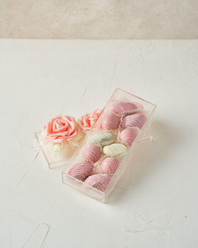 EID Gift Box by NJDChocolate & ConfectioneryYour Gift Contains: • 6 pieces chocolate covered Majdoul dates • 4 pieces Ruby chocolate assorted truffles • Box Size: LxBxH: 19.5x8x4cm Handling and Storage • Keep away from direct heat and sunlight • Best stor