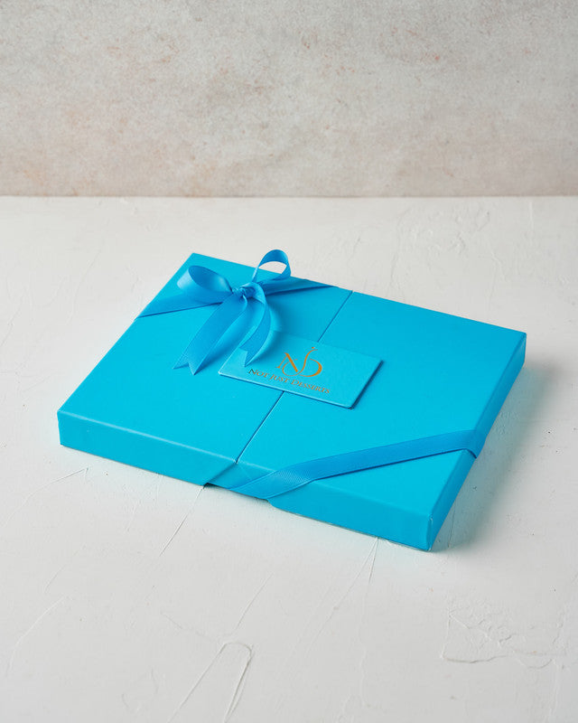 20pcs Designer Box with Dates by NJDChocolate & ConfectioneryYour Gift Contains: • 8 pieces Dark chocolate covered Majdoul dates • 4 pieces Milk chocolate and roasted almond covered majdoul dates • 4 pieces Milk chocolate and roasted Pistachio covered maj