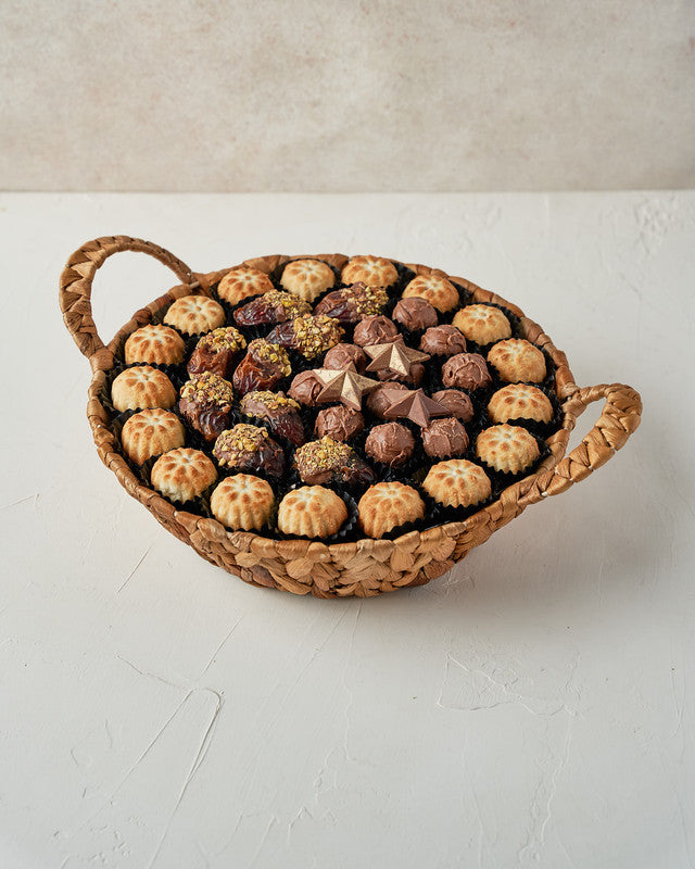 Mamoul and Dates and Truffles Arrangement by NJDChocolate & ConfectioneryYour Gift Contains: • 17 pieces Mamoul • 10 pieces Chocolate covered dates with roasted Pistachio • 12 assorted milk chocolate truffles with Pistachio and Hazelnut fillings • 3 Milk