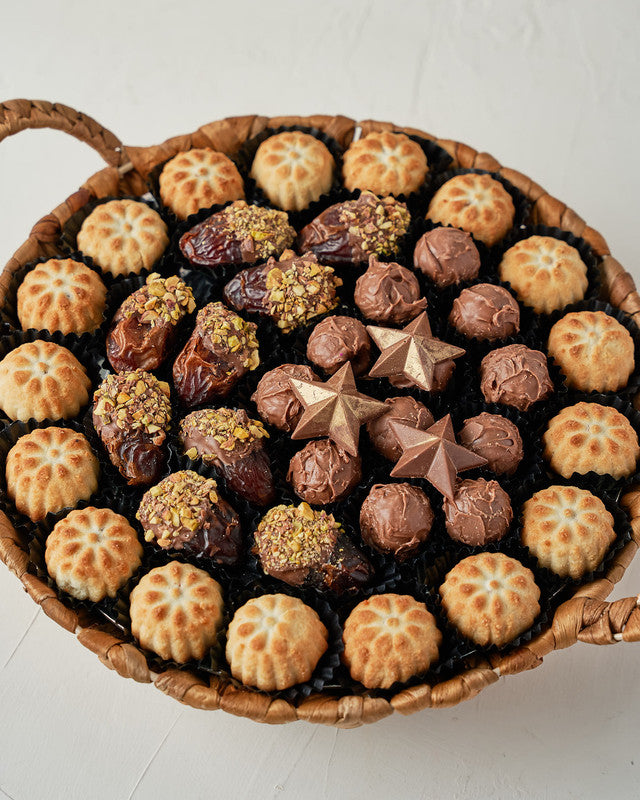 Mamoul and Dates and Truffles Arrangement by NJDChocolate & ConfectioneryYour Gift Contains: • 17 pieces Mamoul • 10 pieces Chocolate covered dates with roasted Pistachio • 12 assorted milk chocolate truffles with Pistachio and Hazelnut fillings • 3 Milk