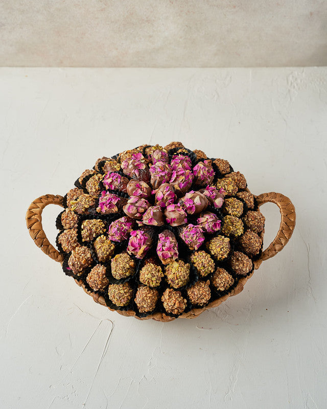 Assorted Dates Hamper by NJDChocolate & ConfectioneryYour Gift Contains: • 22 Milk chocolate covered roasted Almond Majdoul dates • 20 Milk chocolate covered rose petal Majdoul dates • 17 Milk chocolate covered roasted Pistachio Majdoul dates • Tray Size: