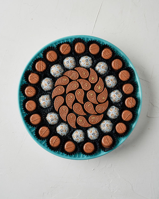 54 Chocolates Arrangement by NJDChocolate & ConfectioneryYour Gift Contains: • 54 milk chocolate in the following flavors: • Hazelnut Praline, Pistachio Praline, Sepculoos, Roasted Nuts, Ganache, Peanut Butter, Almond Praline, Rice Krispies and Black Fore