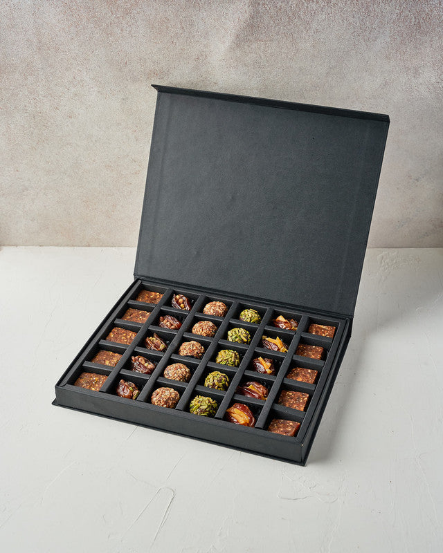 Sugarfree Desserts by NJDChocolate & ConfectioneryYour Gift Contains: • 5 Almond and Dates enegry Balls • 5 Pistachio and Dates enegry Balls • 5 Mango stuffed Majdoul dates • 5 Pistachio stuffed Majdoul dates • 10pcs Pistachio and Almond flavour Energy bi