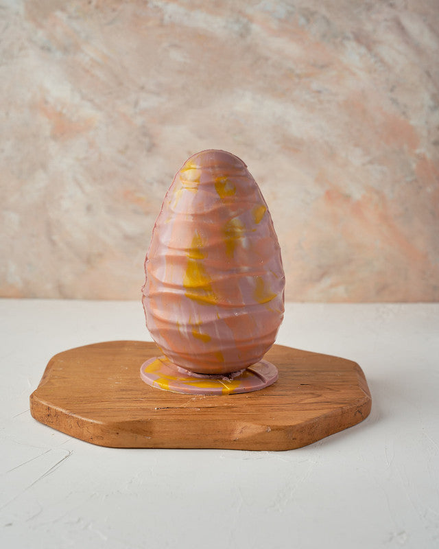 Purple Easter EggChocolate & ConfectioneryYour Gift Contains: • Milk and Color chocolate marble effect chocolate egg • Fillings: Pretzels, Mini marshmallows, drageè • Egg Size: 12.5×12.5x 20cm • Box Size: 13x13x22cm Handling and Storage • Keep away from d