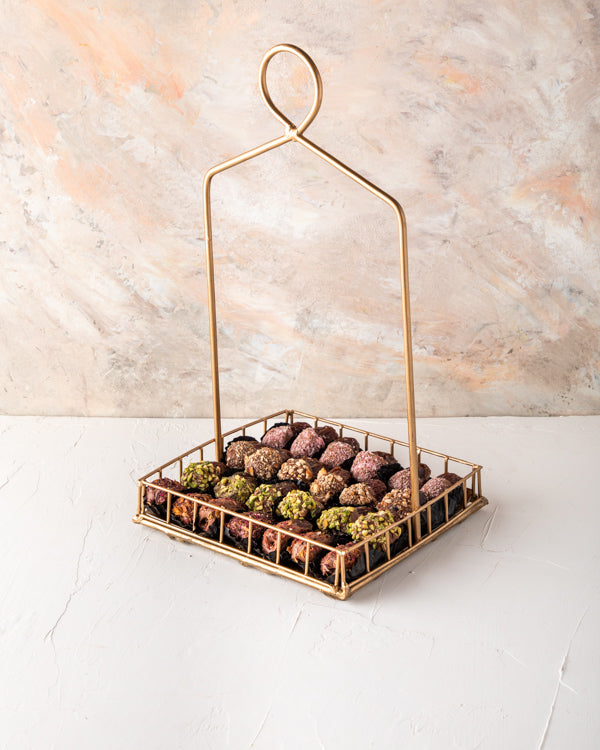 Dates Arrangement 24pcs by NJDNuts Dates & Dried FruitsYour Gift Contains: 24 pieces Chocolate covered dates in following flavors - Coconut flavors: 6 pieces - Roasted Almonds: 6 pieces -Roasted Pistachio: 6 pieces -Rose Flavor: 6 pieces Box/Tray Size: Lx