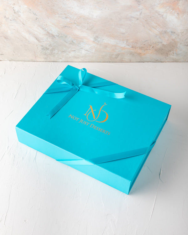 Assorted Chocolates by NJD 30pcsSweetsYour Gift Contains: 30 pieces assorted chocolates in Milk, Dark and White chocolate - Ganache - Pralines - Biscoff Box/Tray Size: LxBxH: 32x25x5cm HANDLING AND STORAGE Keep away from direct heat and sunlight Keep it r