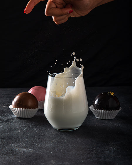 Hot Chocolate Bombs by NJDChocolate & ConfectioneryYour Gift Contains: A set of 4 hot chocolate bombs: Milk chocolate bomb: 2pcs Rose chocolate bomb: 1pcs Dark chocolate bomb: 1pcs Pour it in a cup of lukewarm/hot milk and enjoy Box/Tray Size: LxBxH: 18x1