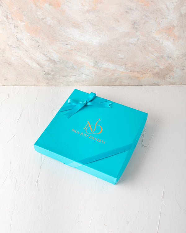 Assorted Dates Pack 25pcs by NJDNuts Dates & Dried FruitsYour gift Contains: 25pcs Chocolate dates covered with: - Pistachio: 5pcs - Cashew: 5pcs - Almond: 5pcs - Coconut: 5pcs - Roasted Nuts: 5pcs Box size: 24x24x4cm HANDLING AND STORAGE Keep away from d