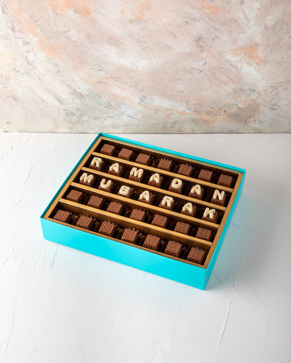 Ramadan Mubarak Customizable Box by NJDSweetsYOUR GIFT CONTAINS 35pieces of pure milk chocolate made with rich Belgian chocolate. Customize your Ramadan greetings and make them feel special. Box/Tray Size: LxBxH: 31x 25.5x6cm HANDLING AND STORAGE Keep awa