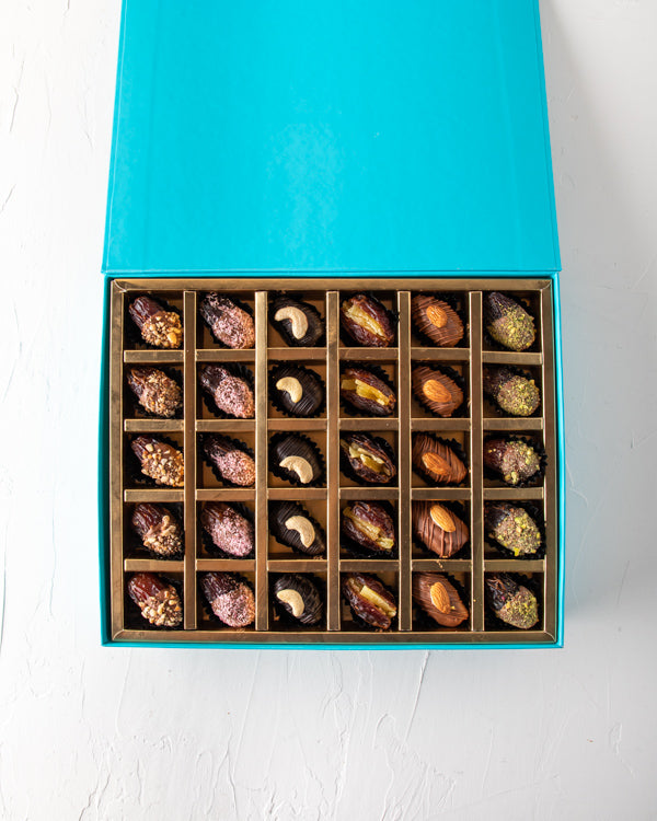 Assorted Dates Collection 60pcs by NJDNuts Dates & Dried FruitsYour Gift Contains: 60 pieces large dates, semi covered in chocolate : Caramelized Almond : 12pcs : Coconut flavors: 12pcs : Cashew flavors: 12pcs : Mango flavors: 12pcs : Almonds flavors: 12p