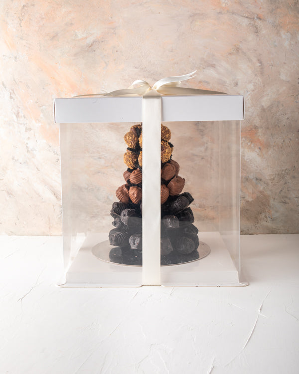 Dates Arrangement by NJDNuts Dates & Dried FruitsYour Gift Contains: 47 chocolate covered dates in assorted flavors Milk chocolate Dark Chocolate Lotus Flavor Coconut flavors Box/Tray Size: LxBxH: 20x20x20cm HANDLING AND STORAGE Keep away from direct heat