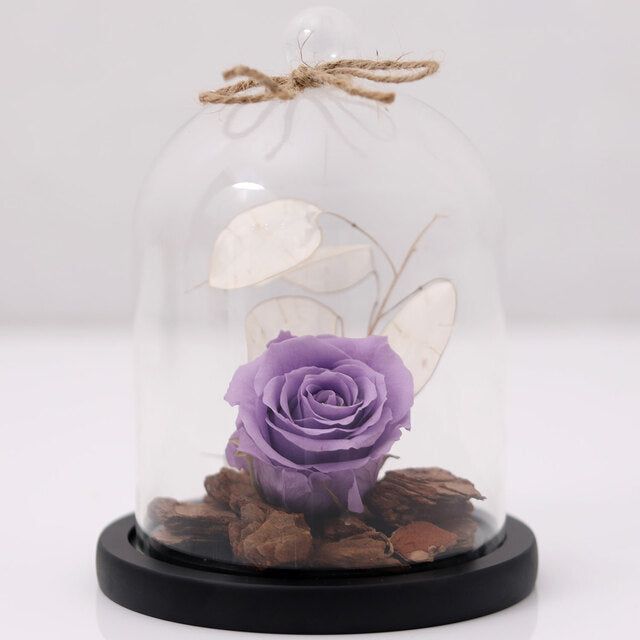 Purple Forever Rose In Glass DomeFlowersOne Forever Rose Colour- Purple Comes in a High Quality Glass Dome Glass Dome is put on a Wooden LID Base