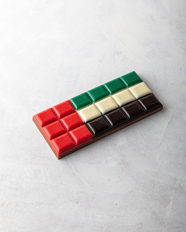 UAE Flag Chocolate BarChocolate & ConfectioneryYOUR GIFT CONTAINS Content: CHOCOLATES 124gms Flavors Belgian Milk Chocolate Chocolate dimensions: Wide: 14.4 cm Height: 1 cm HANDLING AND STORAGE Keep away from direct heat and sunlight All our products are