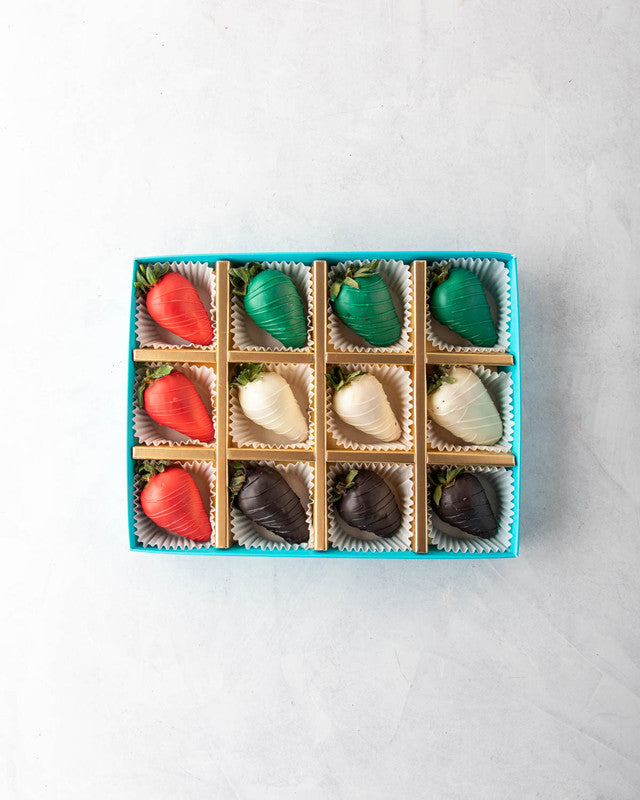 UAE flag StrawberriesChocolate & ConfectioneryYOUR GIFT CONTAINS Content: 12 pcs Milk and Dark Chocolate Coated Strawberries Flavors: White and Dark Chocolate for Strawberry coating Box dimensions: Wide: 24cm Height: 5cm HANDLING AND STORAGE Keep away fro